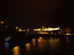 The Vltava river and Prague Castle, with the St. Vitus Cathedral, by night
