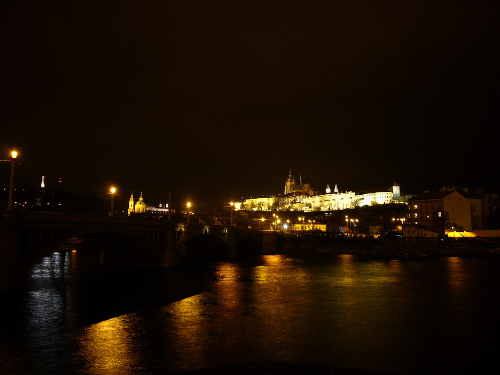 The Vltava river and Prague Castle, with the St. Vitus Cathedral, by night