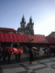 Old Town Square, with the christmas market, a horse tram and the Church of Our Lady before Týn