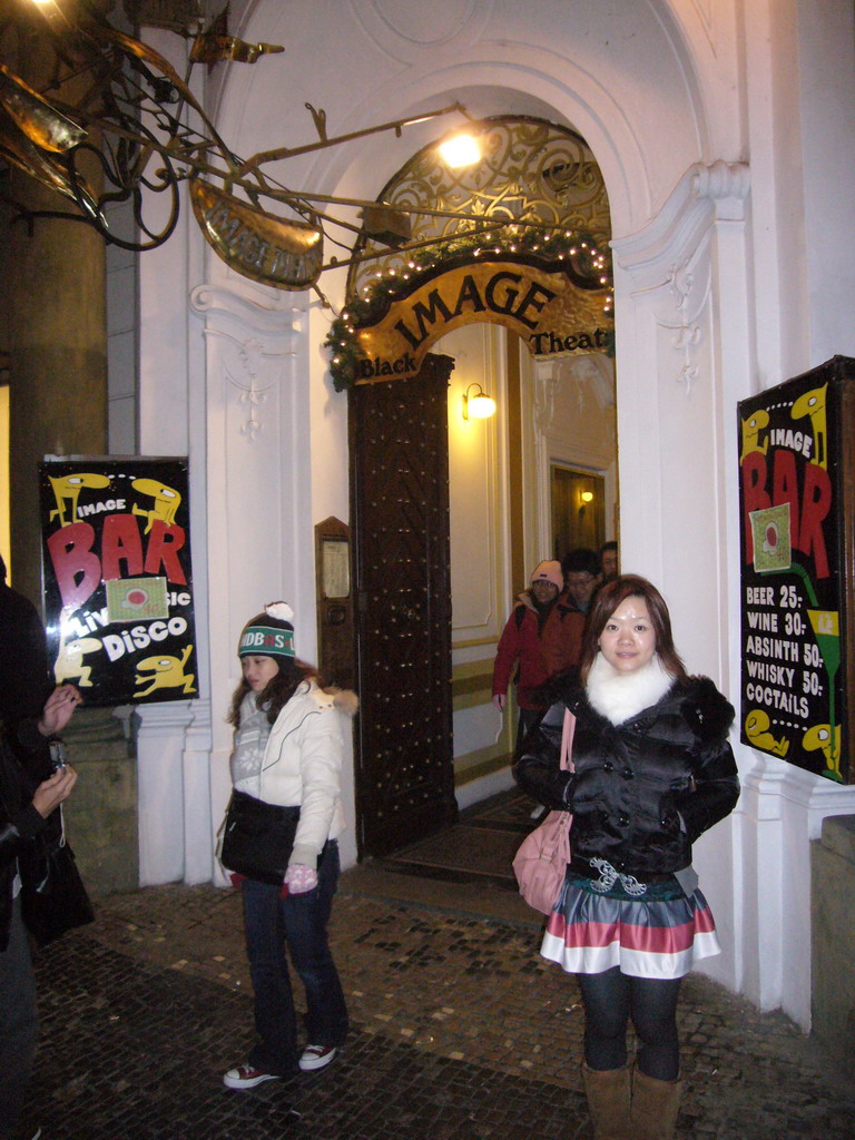 Miaomiao in front of the Black Light Theatre `Image`