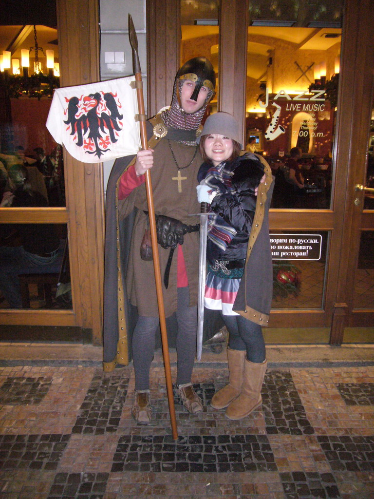 Miaomiao with an actor dressed up like St. Wenceslas, in front of the restaurant Svatého Václava