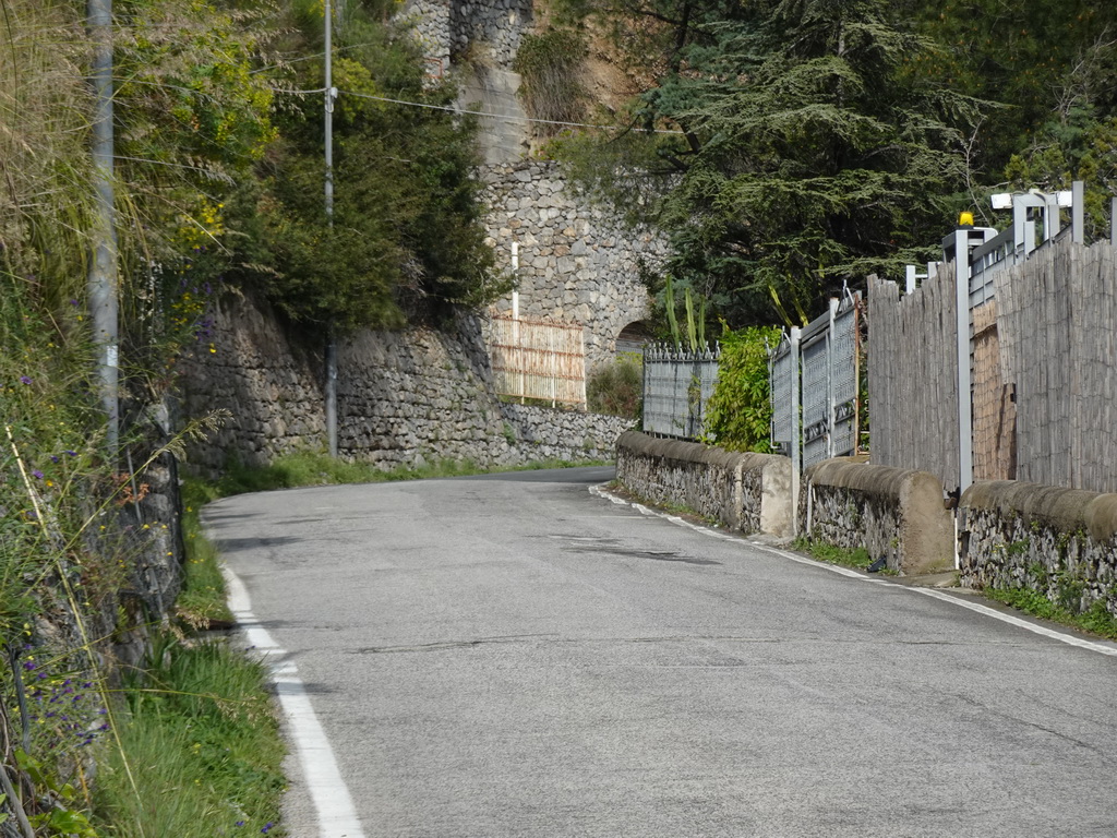 The Via Smeraldo road, viewed from a parking lot of a gas station at the east side of town