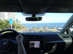 Miaomiao driving the rental car on the TF-316 road on the west side of the city