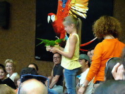 Zookeeper and Parrots at the Loro Show building at the Loro Parque zoo, during the Loro Show