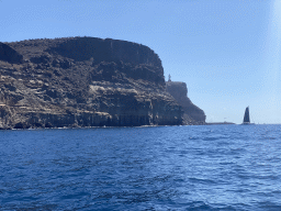 Boat in front of the coastline, viewed from the Sagitarius Cat boat