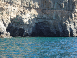 Caves at the coastline on the east side of the town, viewed from the Sagitarius Cat boat