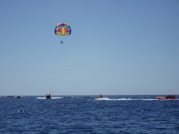 Parasail, jet ski and banana boats, viewed from the Sagitarius Cat boat