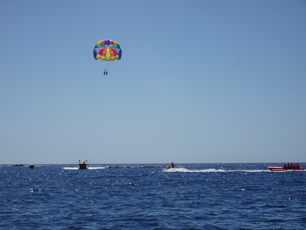 Parasail, jet ski and banana boats, viewed from the Sagitarius Cat boat