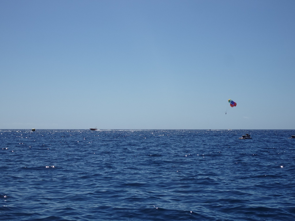 Parasail and jet ski, viewed from the Sagitarius Cat boat
