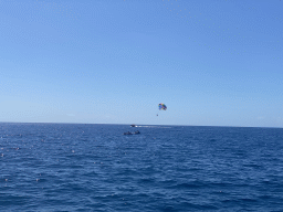 Parasail and jet skis, viewed from the Sagitarius Cat boat