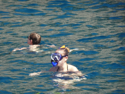People swimming and snorkeling in front of the coastline just east of the town, viewed from the Sagitarius Cat boat