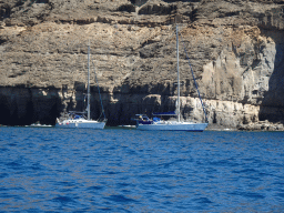 Boats just northwest of the northwestern Playa de Tiritaña beach, viewed from the Sagitarius Cat boat