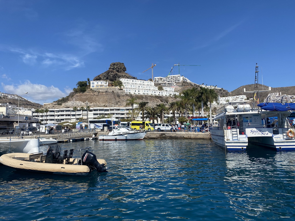 The harbour, a rock and the Marina Bayview Gran Canaria hotel, viewed from the Sagitarius Cat boat
