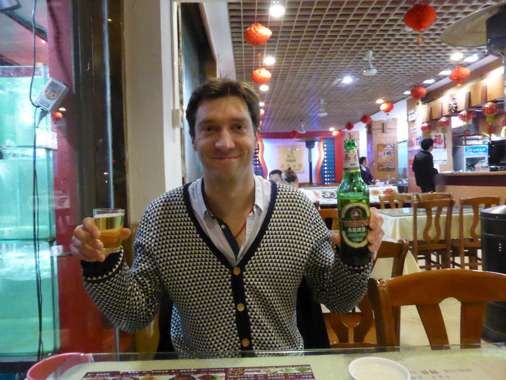 Tim with Tsingtao beer at our dinner restaurant at the crossing of Hubei Road and Henan Road