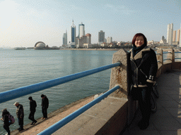 Miaomiao with the beach, Qingdao Bay and skyscrapers and dome at the west side of the city