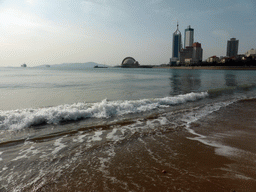 The beach at Qingdao Bay and skyscrapers and dome at the west side of the city, viewed from Taiping Road