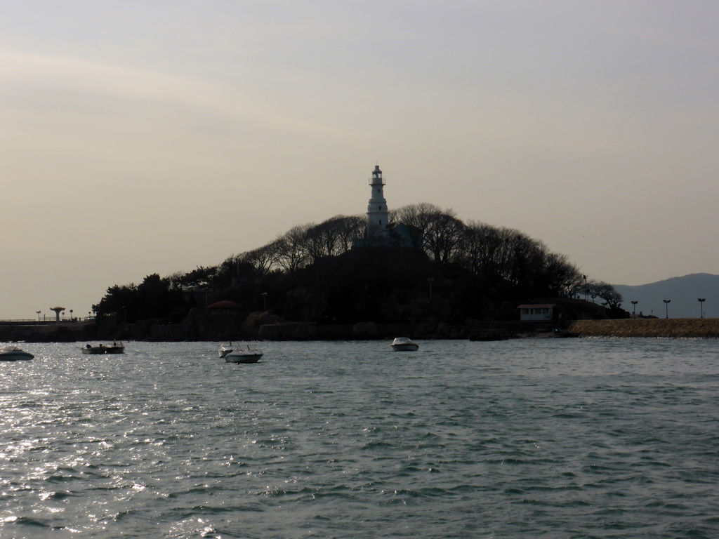 Xiao Qingdao island with its lighthouse in Qingdao Bay, viewed from the tour boat