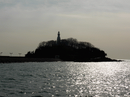 Xiao Qingdao island with its lighthouse in Qingdao Bay, viewed from the tour boat