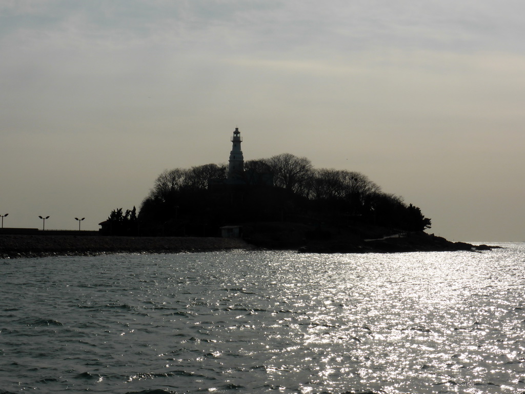 Xiao Qingdao island with its lighthouse in Qingdao Bay, viewed from the tour boat