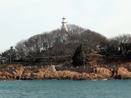 Xiao Qingdao island with its lighthouse in Qingdao Bay, viewed from the tour boat