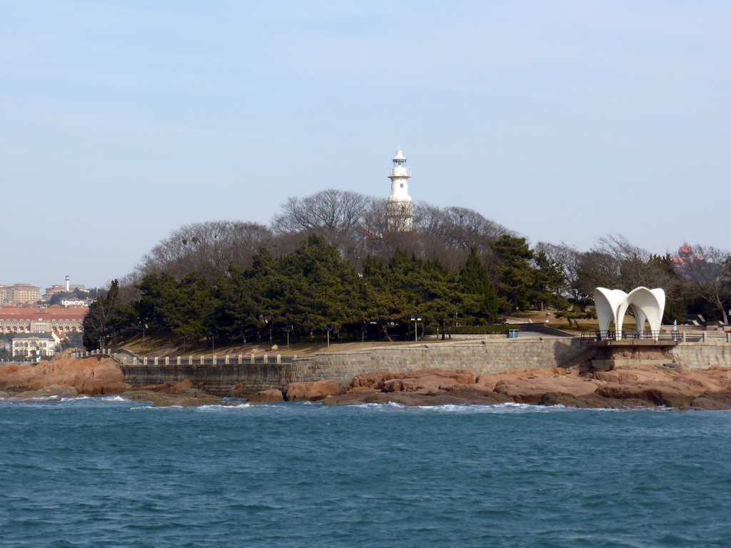 Xiao Qingdao island with its lighthouse and pavilion in Qingdao Bay, viewed from the tour boat