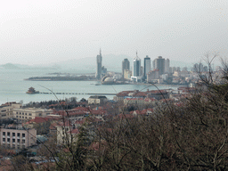 The skyscrapers and dome at the west side of the city, the Zhan Qiao pier, the Qingdao bay and the city center, viewed from the viewing point at the Xinhaoshan Park