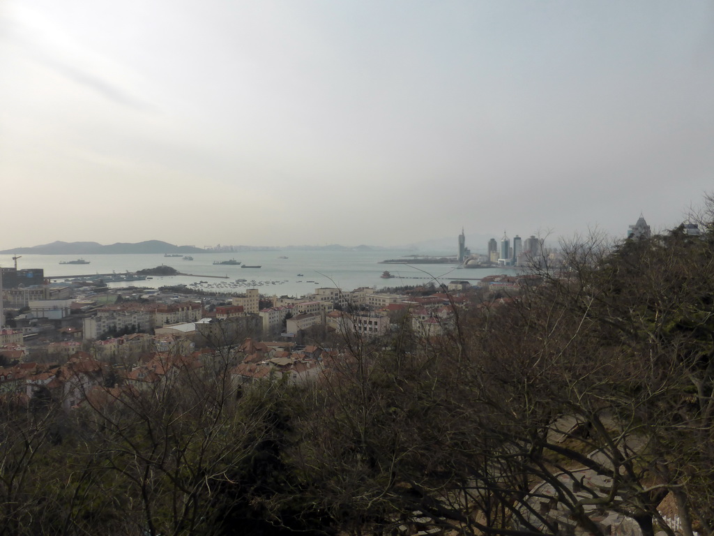 The city center, Xiao Qingdao island and Zhan Qiao pier in Qingdao Bay and skyscrapers and dome at the west side of the city, viewed from the viewing point at the Xinhaoshan Park