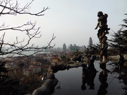 The Jade Dragon Pool at the Xinhaoshan Park, with a view on the skyscrapers at the city center and the Zhan Qiao pier in Qingdao Bay