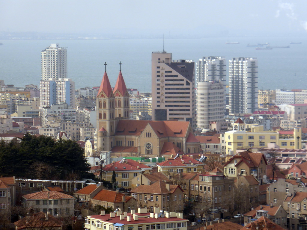 St. Michael`s Cathedral and surroundings and Jiaozhou Bay, viewed from the rotating sightseeing tower at the Xinhaoshan Park