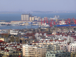 The northwest side of the city with the harbour and the Jiaozhou Bay Bridge in the Jiaozhou Bay, viewed from the rotating sightseeing tower at the Xinhaoshan Park