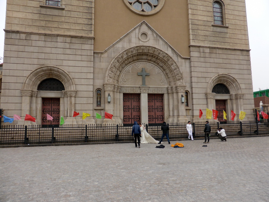Wedding couples in front of St. Michael`s Cathedral at Zhejiang Road