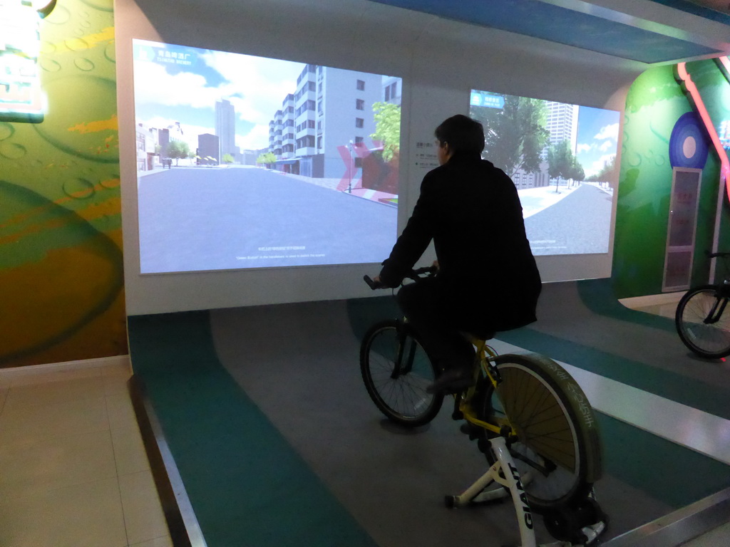 Tim on a bike doing a virtual tour through Qingdao, at the Tsingtao Beer Museum