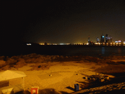 The beach, Zhan Qiao pier, Qingdao Bay and skyscrapers at the west side of the city, viewed from Taiping Road, by night
