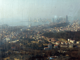 The city center, Xiao Qingdao island and Zhan Qiao pier in Qingdao Bay and skyscrapers and dome at the west side of the city, viewed from the highest indoor level at the Qingdao TV Tower