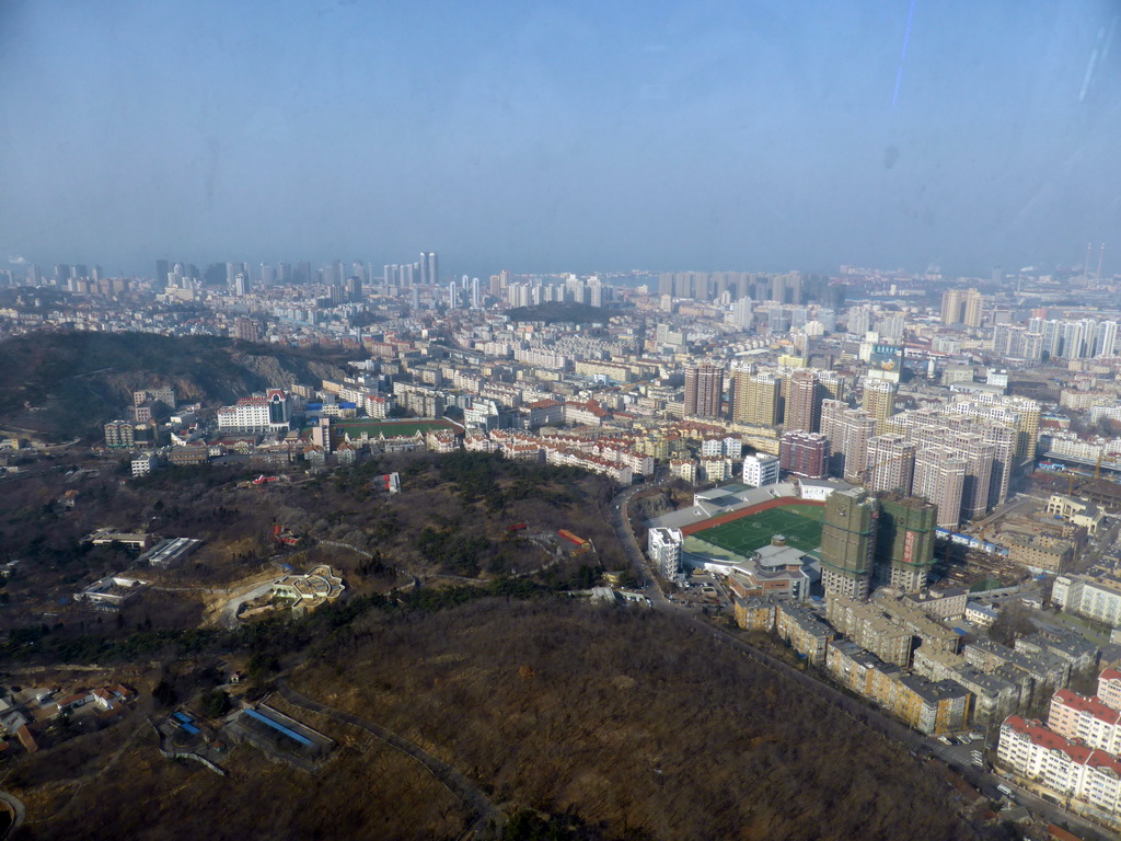 The northwest side of the city with the Qingdaoshan Fort Site, the Zhushui Mountain and the Jiaozhou Bay, viewed from the highest indoor level at the Qingdao TV Tower