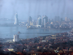 The Zhan Qiao Pier in Qingdao Bay and skyscrapers and dome at the west side of the city, viewed from the highest indoor level at the Qingdao TV Tower