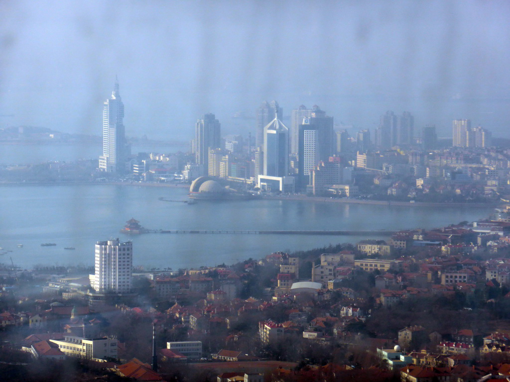 The Zhan Qiao Pier in Qingdao Bay and skyscrapers and dome at the west side of the city, viewed from the highest indoor level at the Qingdao TV Tower