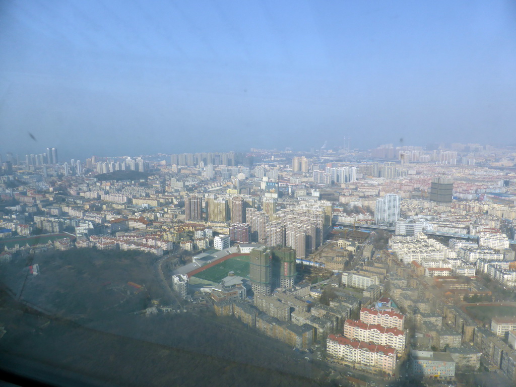 The northwest side of the city with the Zhuzhui Mountain and the Jiaozhou Bay, viewed from the highest indoor level at the Qingdao TV Tower