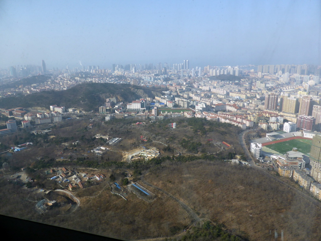 Qingdao Zongshan Park and the northwest side of the city with the Qingdaoshan Fort Site, the Guanxiangshan Park, the Zhushui Mountain and the Jiaozhou Bay, viewed from the highest indoor level at the Qingdao TV Tower