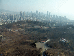 Qingdao Zongshan Park and the skyscrapers and World Trade Center buildings at the east side of the city, viewed from the highest indoor level at the Qingdao TV Tower