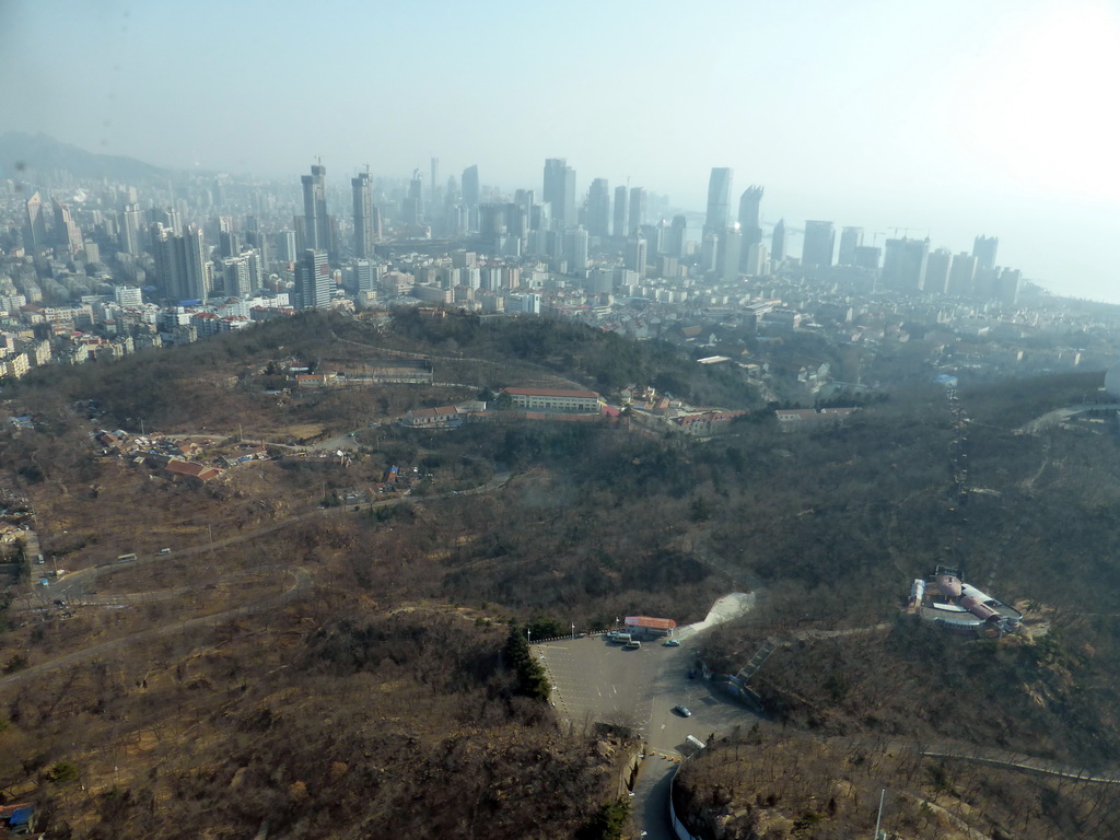 Qingdao Zongshan Park and the skyscrapers and World Trade Center buildings at the east side of the city, viewed from the highest indoor level at the Qingdao TV Tower