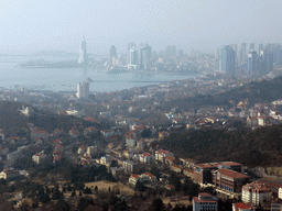 The city center, Zhan Qiao pier in Qingdao Bay and skyscrapers and dome at the west side of the city, viewed from the outdoor level at the Qingdao TV Tower