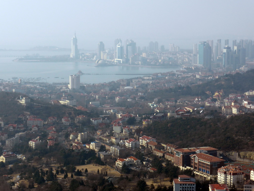 The city center, Zhan Qiao pier in Qingdao Bay and skyscrapers and dome at the west side of the city, viewed from the outdoor level at the Qingdao TV Tower
