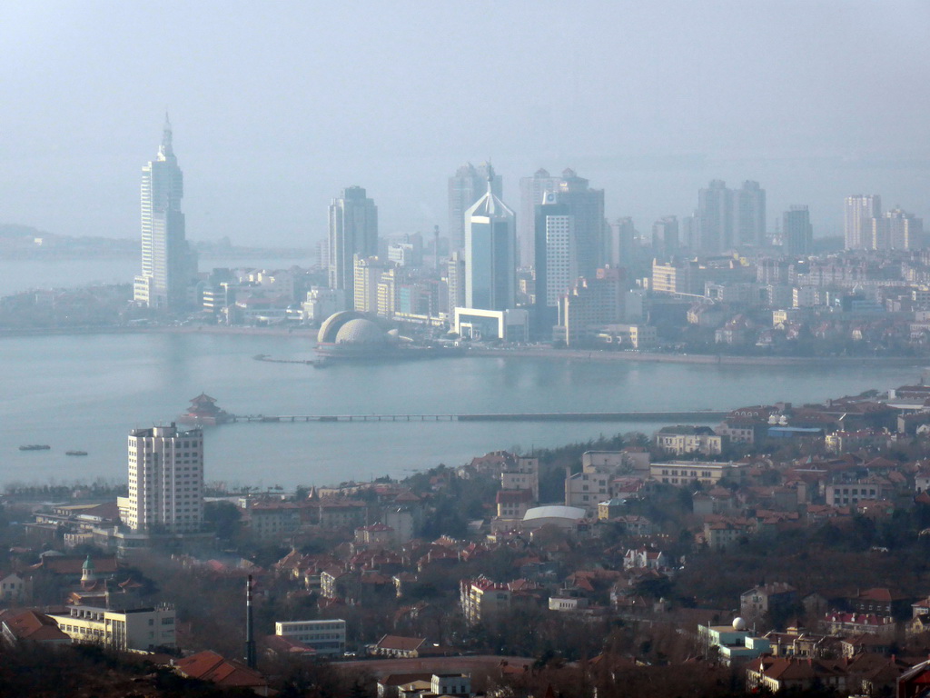 The city center, Zhan Qiao pier in Qingdao Bay and skyscrapers and dome at the west side of the city, viewed from the outdoor level at the Qingdao TV Tower