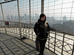Miaomiao at the outdoor level at the Qingdao TV Tower, with a view on the skyscrapers at the east side of the city, the World Trade Center buildings, two domes at the Qingdao Zongshan Park, the Majesty Mansion at Donghai West Road and Fushan Bay