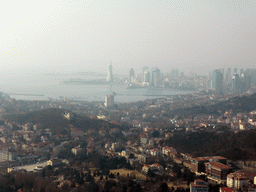 The city center, Zhan Qiao pier in Qingdao Bay and skyscrapers and dome at the west side of the city, viewed from the outdoor level at the Qingdao TV Tower