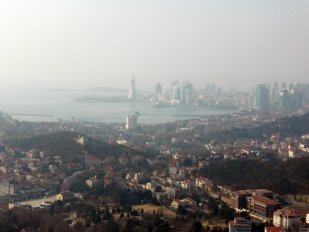 The city center, Zhan Qiao pier in Qingdao Bay and skyscrapers and dome at the west side of the city, viewed from the outdoor level at the Qingdao TV Tower