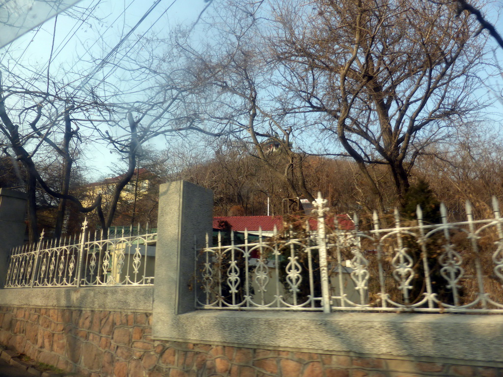 House on a hill near Wendeng Road, viewed from the taxi to the hotel