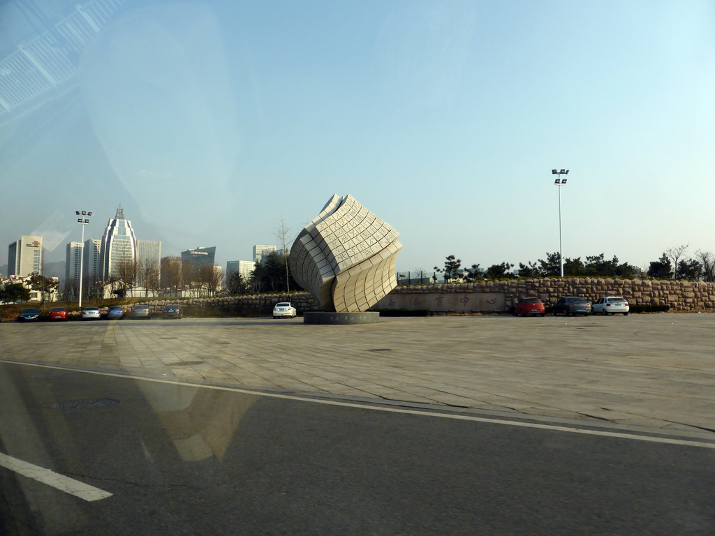 Piece of art at the north side of the Qingdao Sports Center at Tong`An Road, viewed from the taxi to the airport