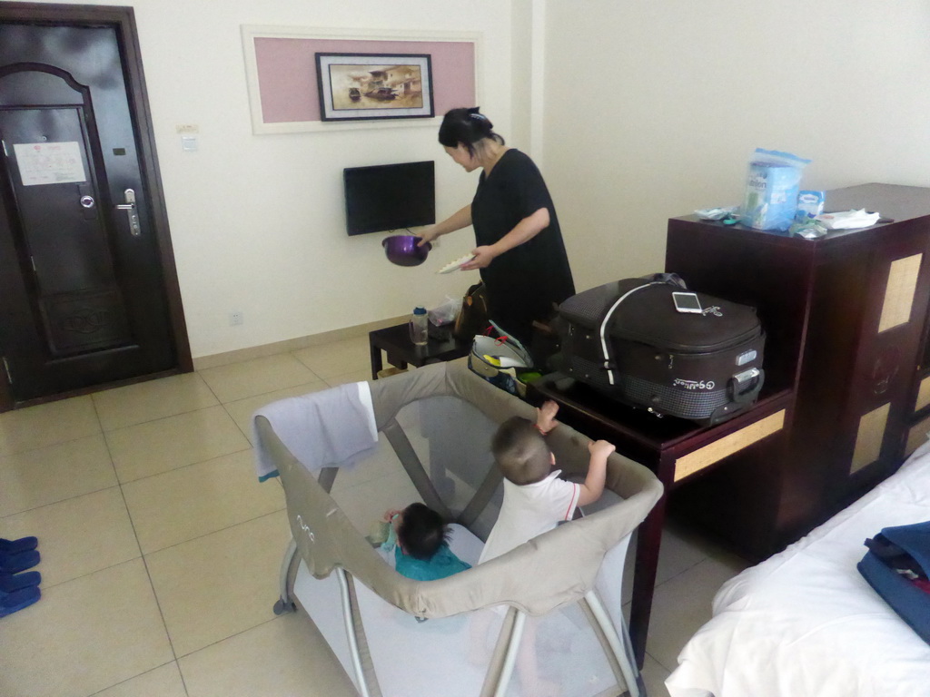 Miaomiao, Max and his cousin in our room at the Guantang Hot Spring Resort